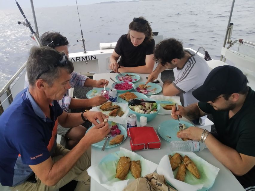 Athens: Fishing Trip Experience on a Boat with Seafood Meal - The onboard meal: snacks, Greek pie, seafood pasta, and fish you catch