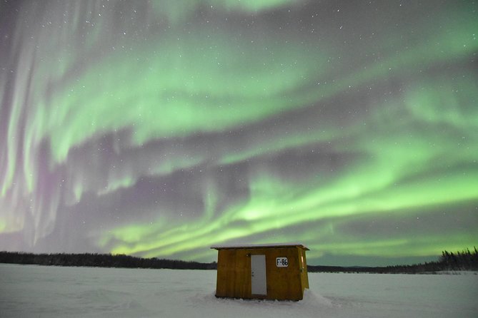 Aurora Borealis Viewing and Ice Fishing Adventure - Inside the deluxe fishing cabin: the warmth is the secret sauce