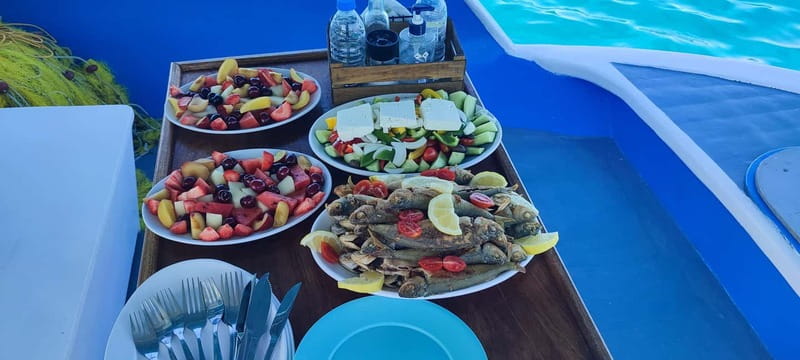 Crete: Boat Cruise with Fishing, Swimming, Lunch, and Drinks - Lunch onboard: today’s catch, Greek salad, and unlimited drinks