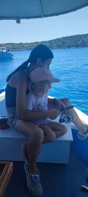 Crete: Boat Cruise with Fishing, Swimming, Lunch, and Drinks - Transfers, pickup zones, and how to dress for a boat day