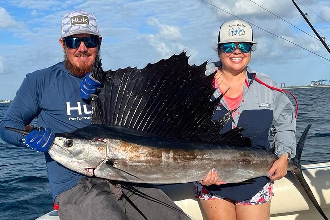 Deep sea fishing charters in Fort Lauderdale aboard 52' Hatteras - The Crew Makes the Difference: Capt. Dave, Kyle, and Captain Tom