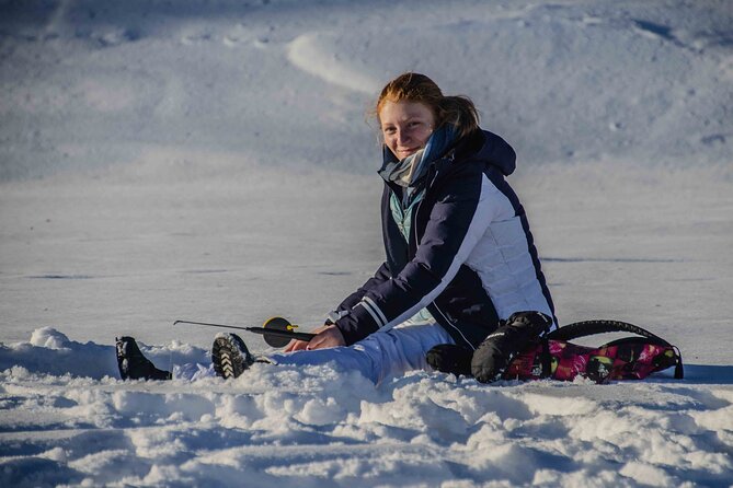 First Ice Fishing Experience in Rovaniemi - Learning the basics: drilling the hole and fishing techniques