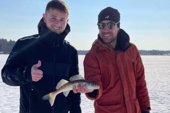 Ice fishing experience with Backpacker Helsinki Tour - Fireside Finnish food: sausages, glögi, and piparri