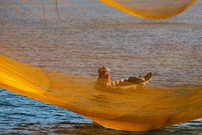 Photography Tour Hoi An Fishing Nets - Duy Vinh Fishing Village: net repair for close-up storytelling