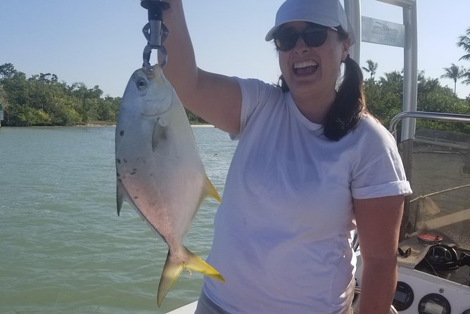Private Fishing Boat Charters in Naples Bay and the Gulf - The boat setup: 22-foot comfort, T-top shade, and real safety gear