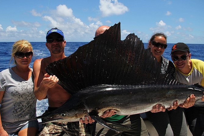 Private Punta Cana Six Hour Fishing Charter - Indoor-outdoor boat comfort, lunch, drinks, and snorkeling for non-fishers