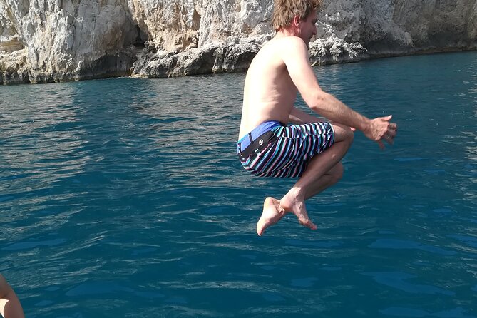 Private tour with fishing, tour of Capri and lunch on board - Capri port, a village moment, and Marina Piccola swim break