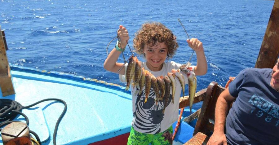 Rhodes Town: Fishing Boat Trip with Fish Meal and Swim Stops - Rhodes from the water: multiple fishing stops and the scenic Rhodes Town views