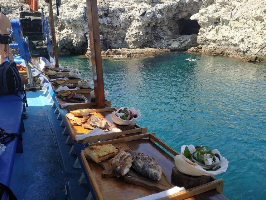 Rhodes Town: Fishing Boat Trip with Fish Meal and Swim Stops - Swim stop and snorkeling in a secluded cove: equipment included, and how to plan your comfort