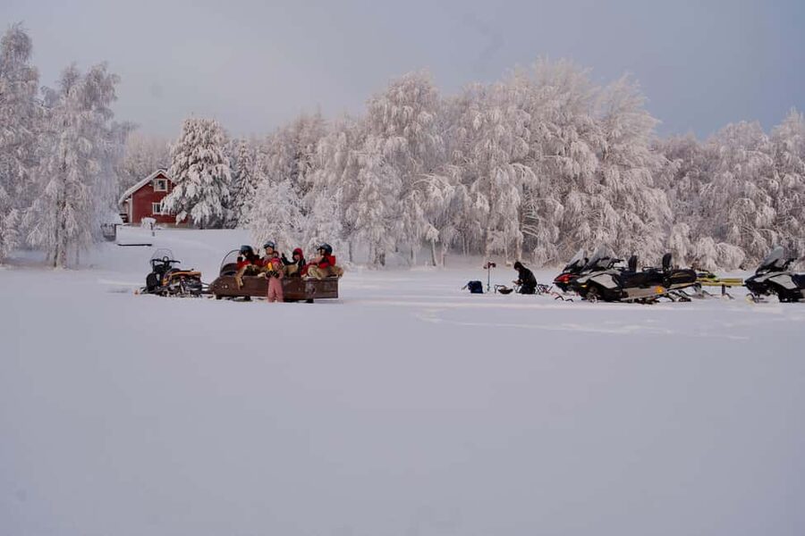 Rovaniemi: Ice Fishing and Snowmobile Tour with Snacks - Snowmobile Onto the Frozen Lake: Safety Gear and Real Confidence