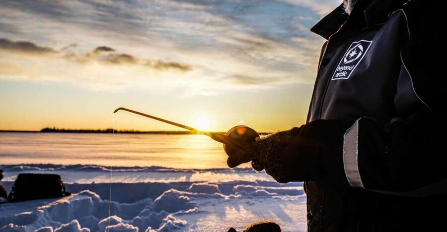 Rovaniemi: Ice Fishing on a Frozen Lake with BBQ and Photos - Getting to the Lake: 20 Minutes by Minivan, Then Right Into Winter