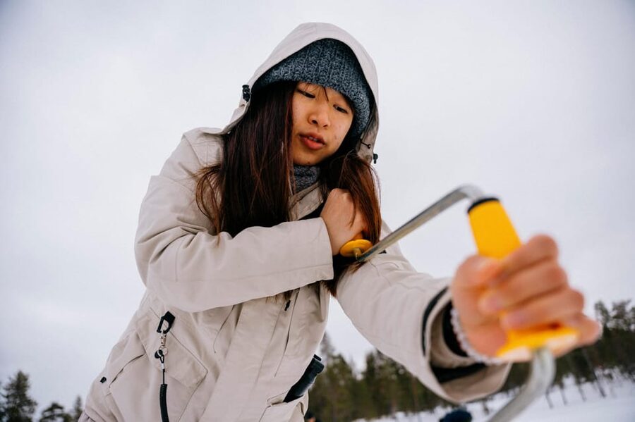 Saariselkä: Ice Fishing Adventure - On-Ice Drilling With an Auger: Your Hands-On Moment