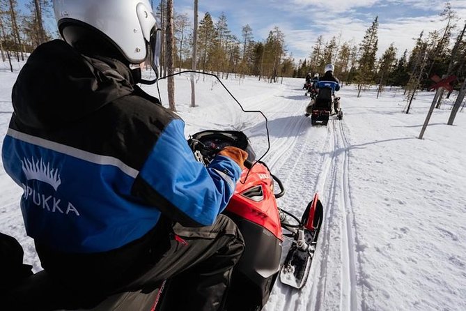 Snowmobiling and ice fishing in Apukka Resort, Rovaniemi - The snowmobile ride: how Lapland winter turns from cold to fun
